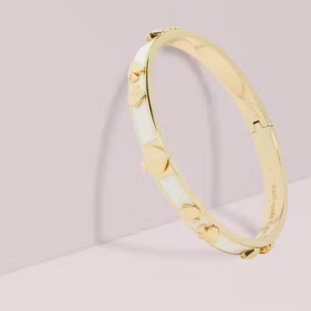 kate Spade Heritage Gold and White Enamel Hinged Cuff Bracelet